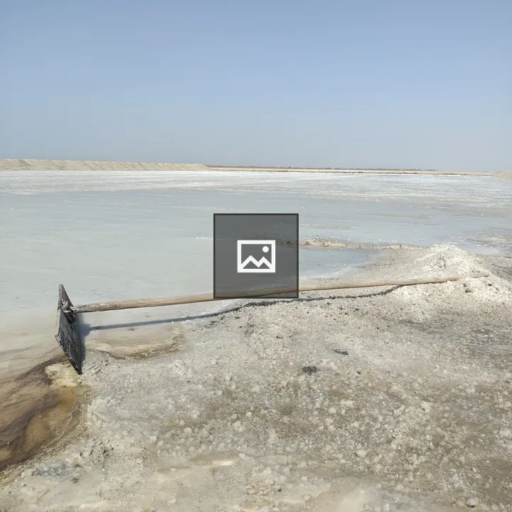 Salt flat under blue sky