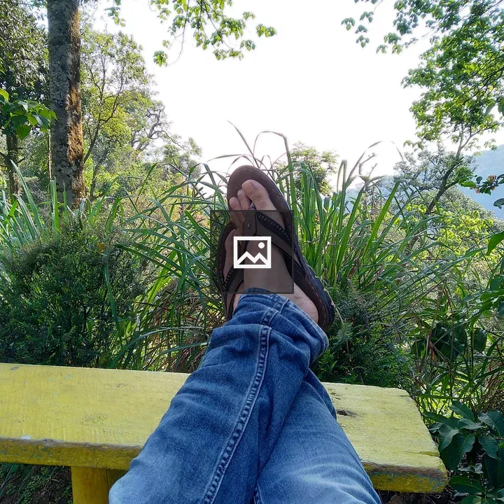Legs in Jeans and Sandals