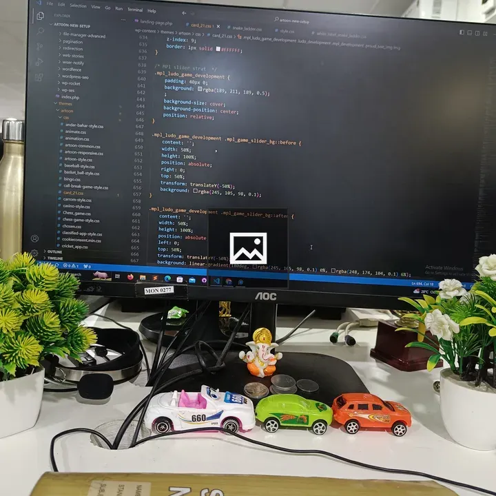 Office desk with monitor and plants
