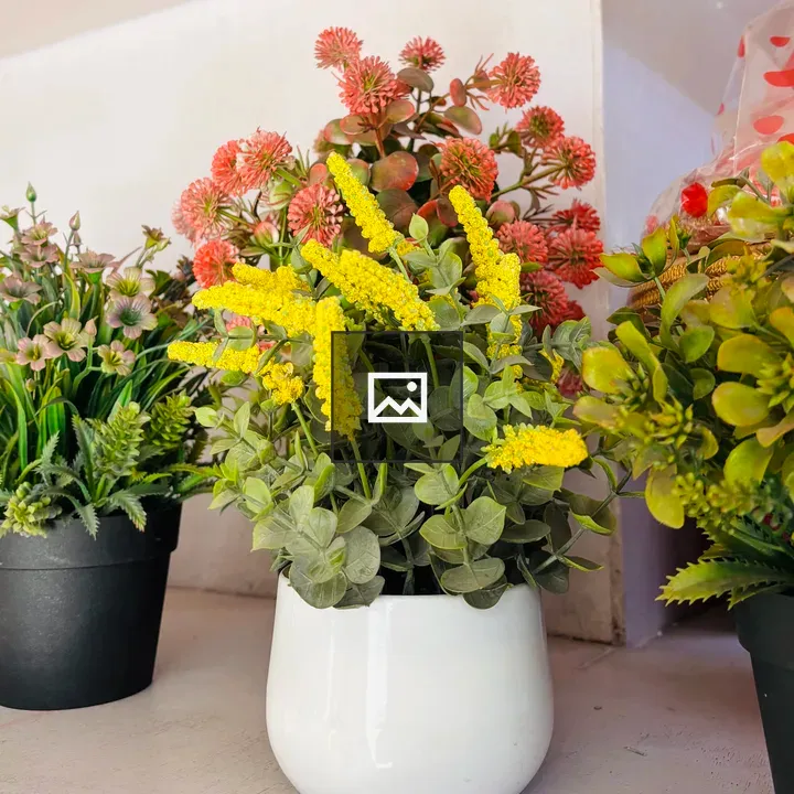 White ceramic pot with yellow flowers
