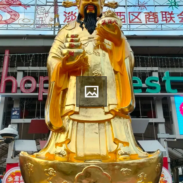 Caishen statue in marketplace