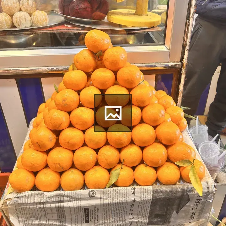 Pyramid of fresh oranges