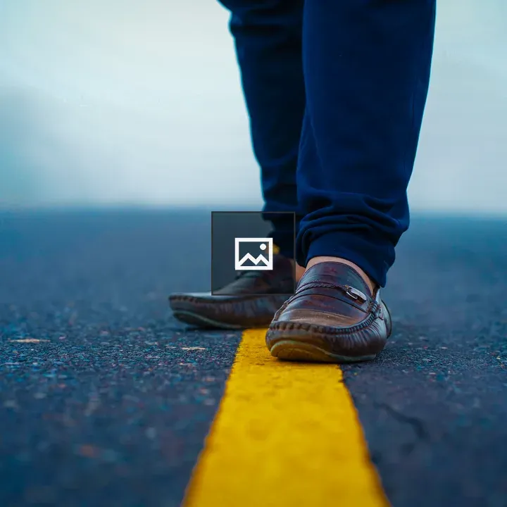 Person on Desolate Road with Yellow Line