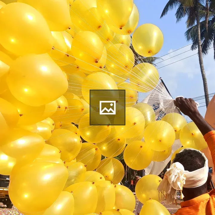 Man with Yellow Balloons