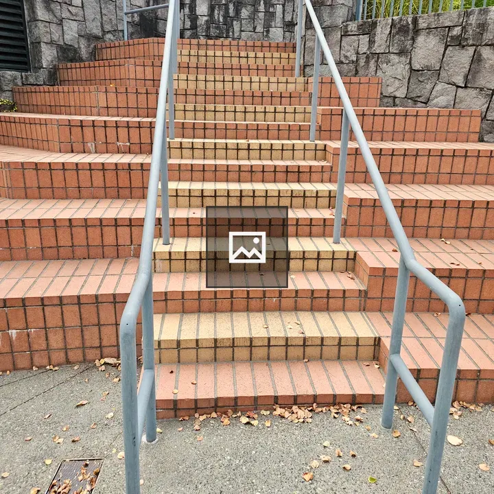 Brick stairway with metal handrails