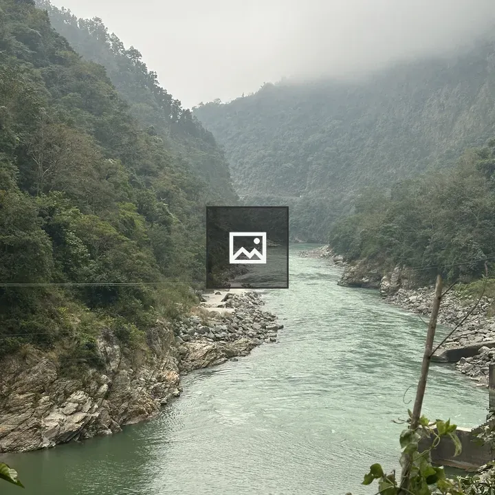 Winding river through green hills