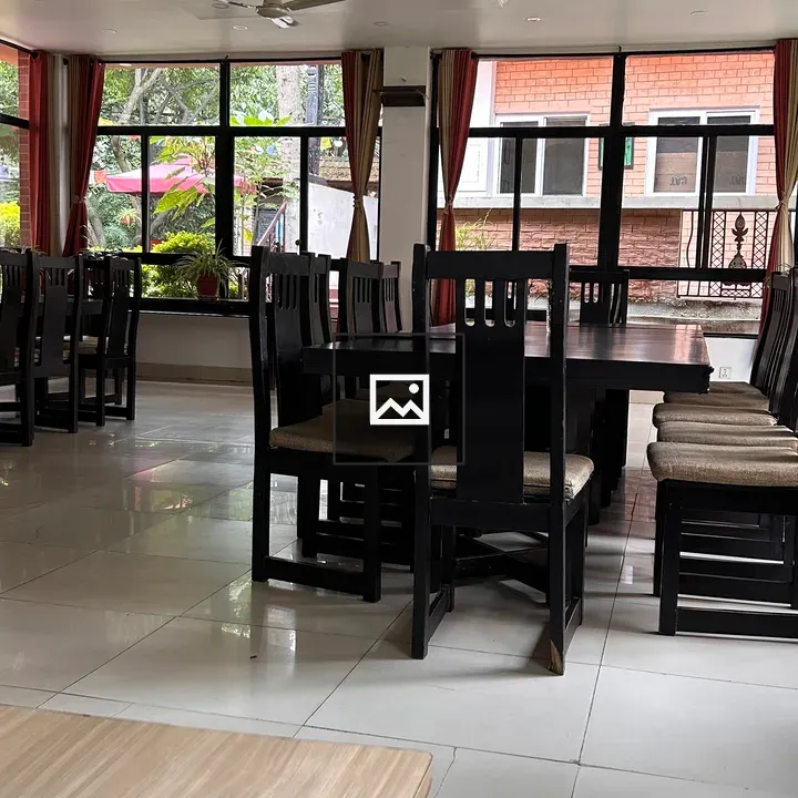 Dining area with black tables and chairs
