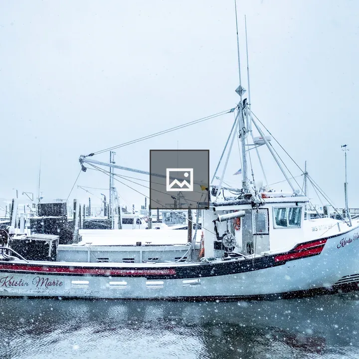 Heavy Snow on Docked Fishing Boat