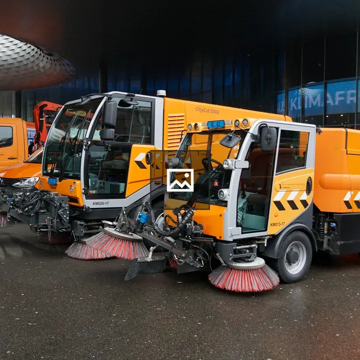 Orange street cleaning vehicles