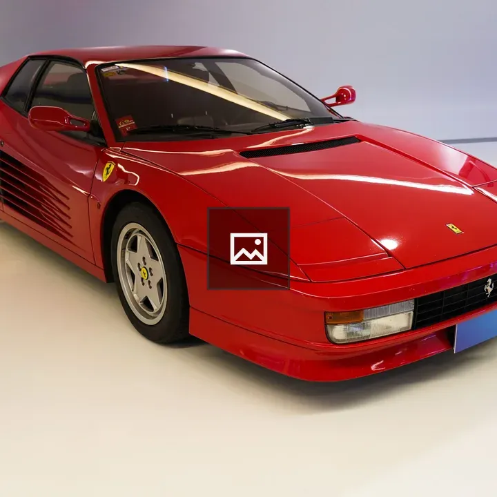 Red sports car in studio