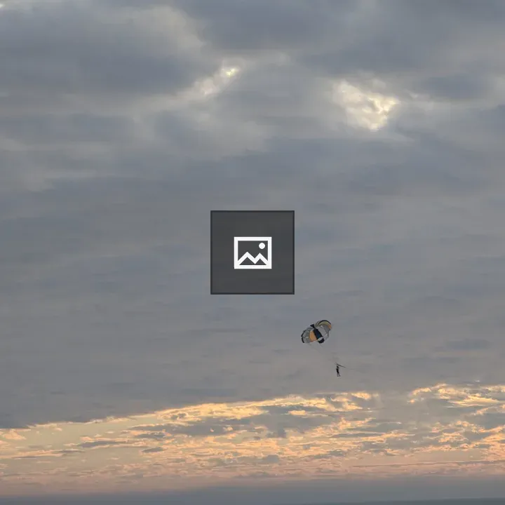 Parasailing under Colorful Parachute