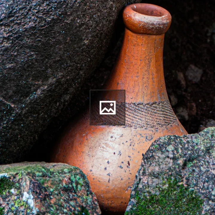 Terracotta Pot Among Rocks
