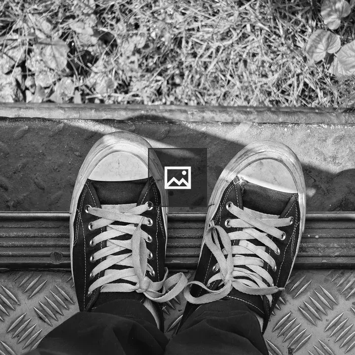 Tennis Shoes on Step with Grass