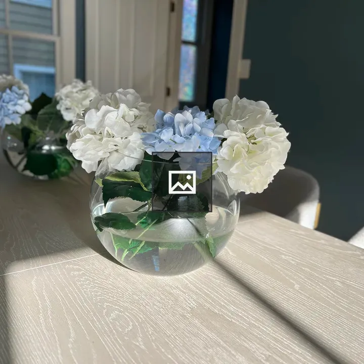 Hydrangeas in a globe vase