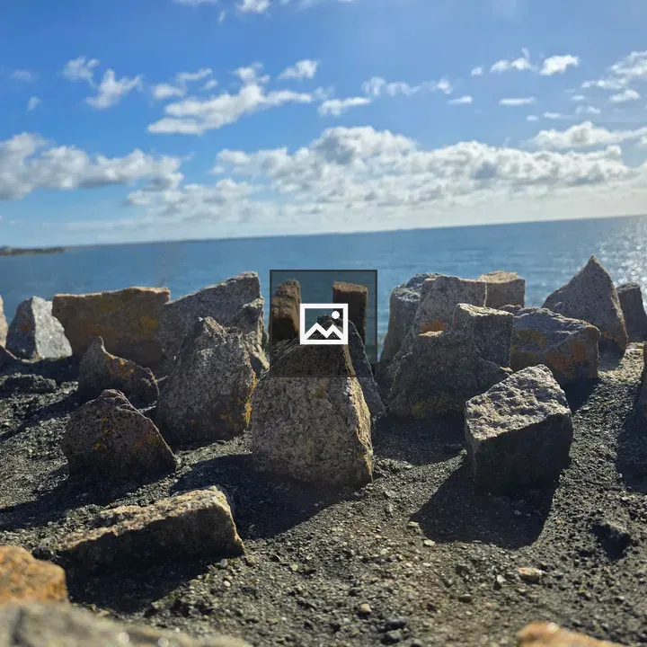 Rocky coast under blue sky