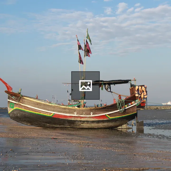 Traditional wooden fishing boat on beach