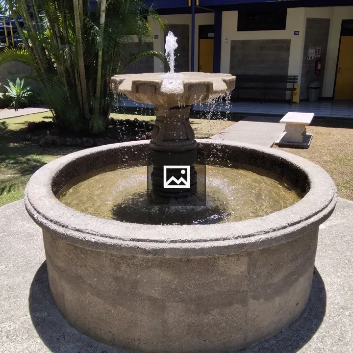 Circular stone fountain centerpiece
