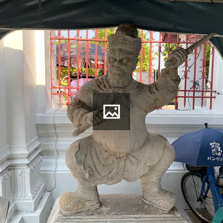 Statue of a man with a stick