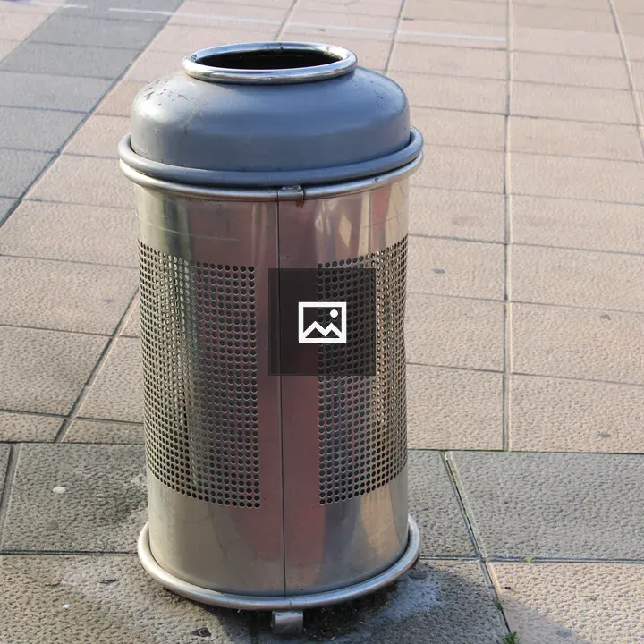 Metal Trash Can on Stone Walkway
