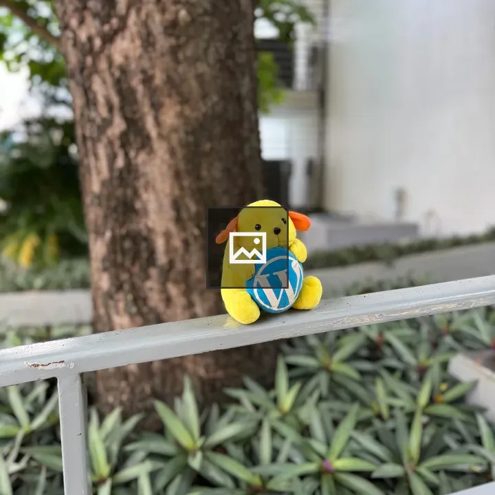 Wapuu stuffed animal on railing
