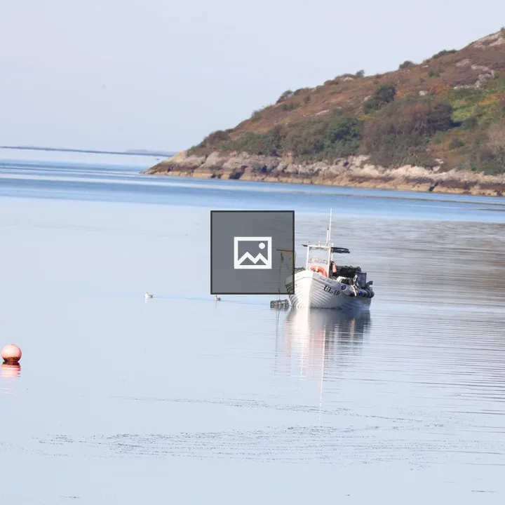 Small fishing boat on Loch Broom