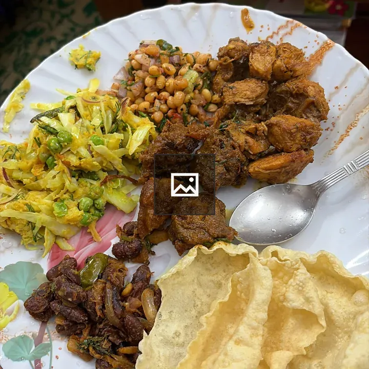 White plate of mixed foods