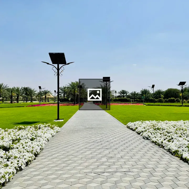Park walkway with street lamps
