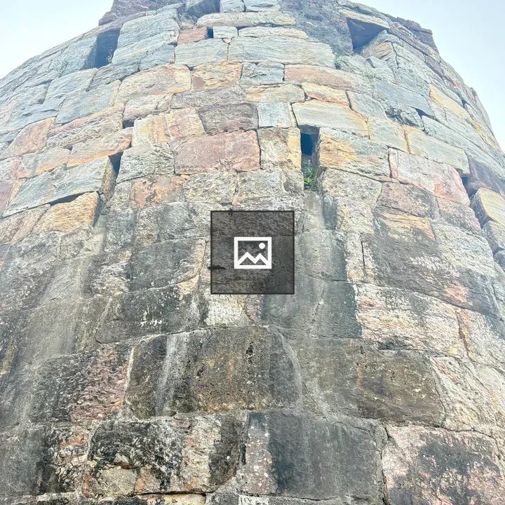 Stone tower with orange flag