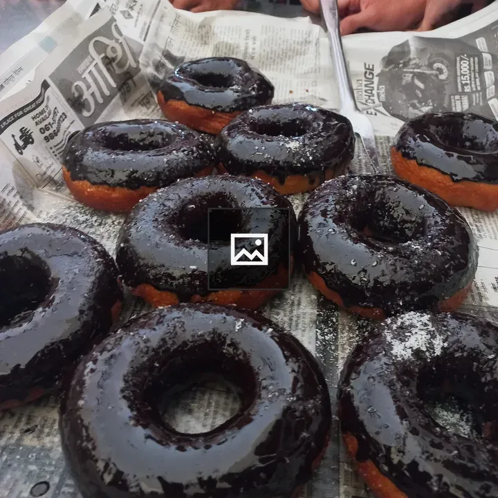 Chocolate-glazed donuts close-up