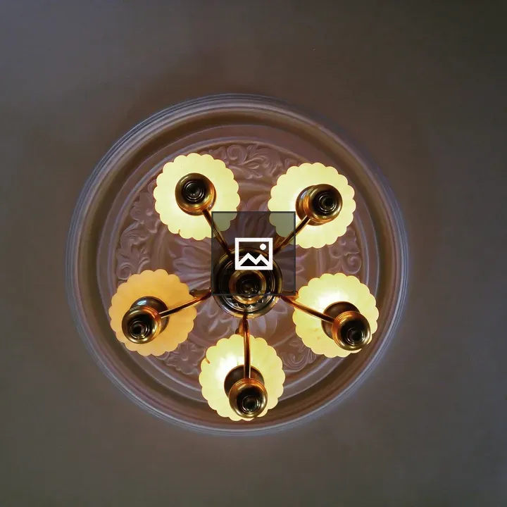 Light Bulbs Aglow in Ceiling Fixture