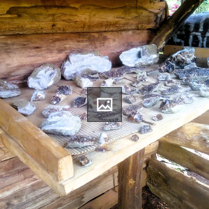 Rocks and crystal geodes on shelf