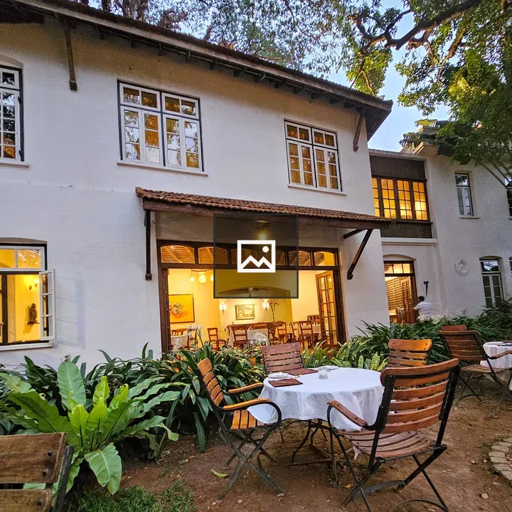 White colonial building with patio