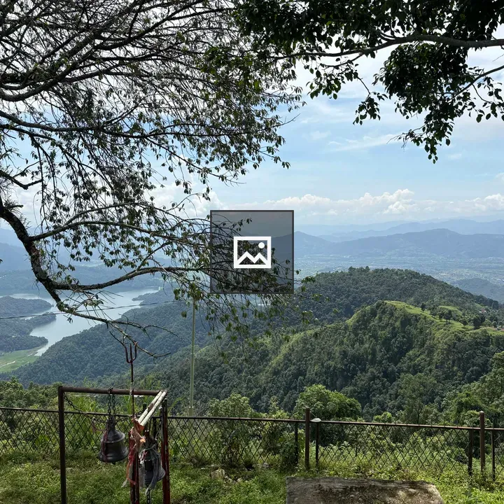 Scenic high point over green hills and lake