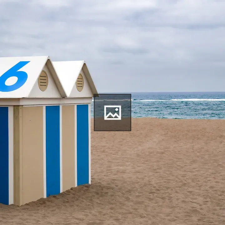 Beach hut with number 6 on roof