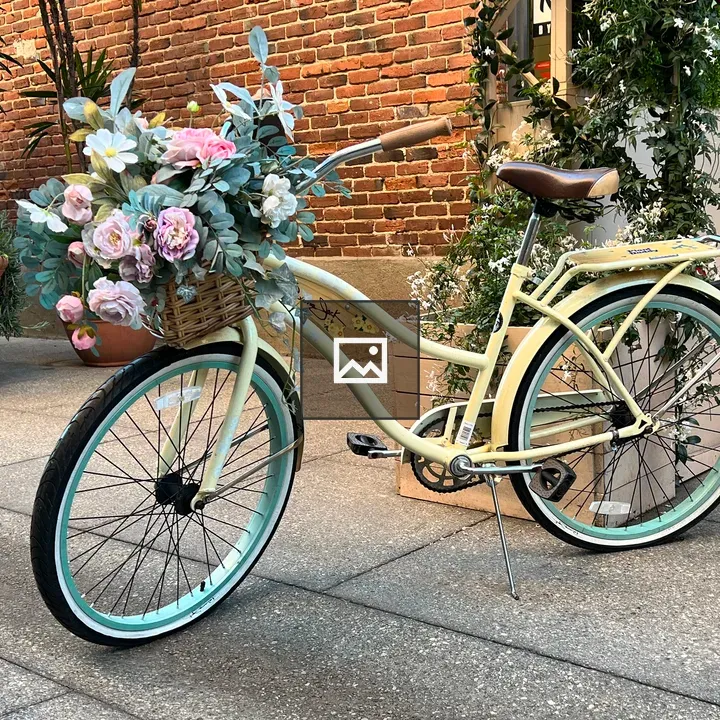 Yellow bicycle with flowers