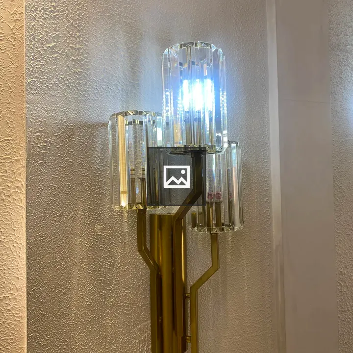Gold wall sconce with glass shades