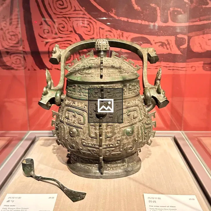 Bronze ritual vessel with ornate handles