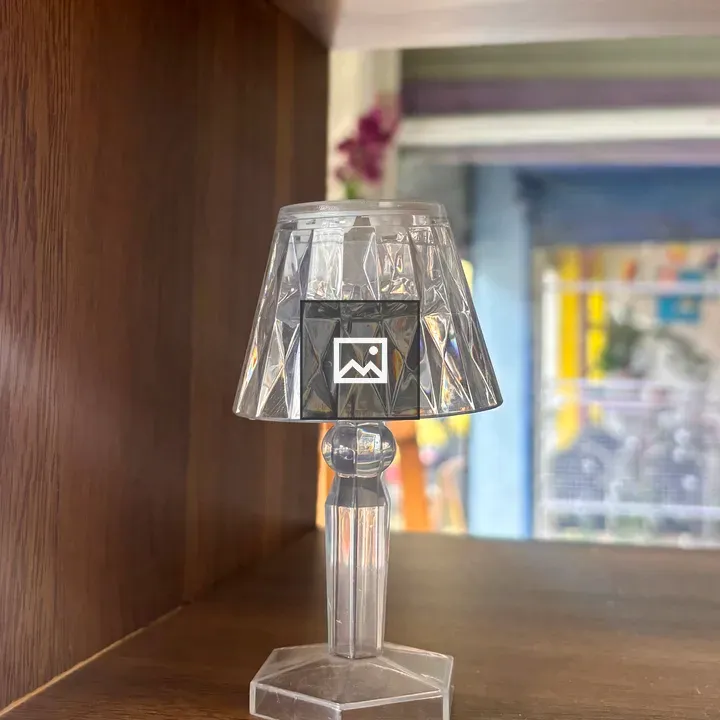Faceted Plastic Lamp on Wood Shelf
