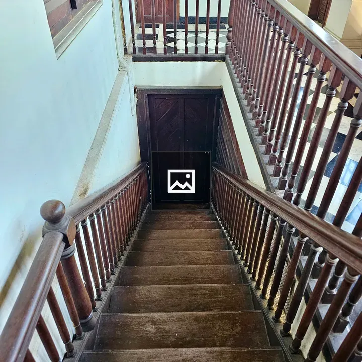 Polished wooden staircase in Hill Palace