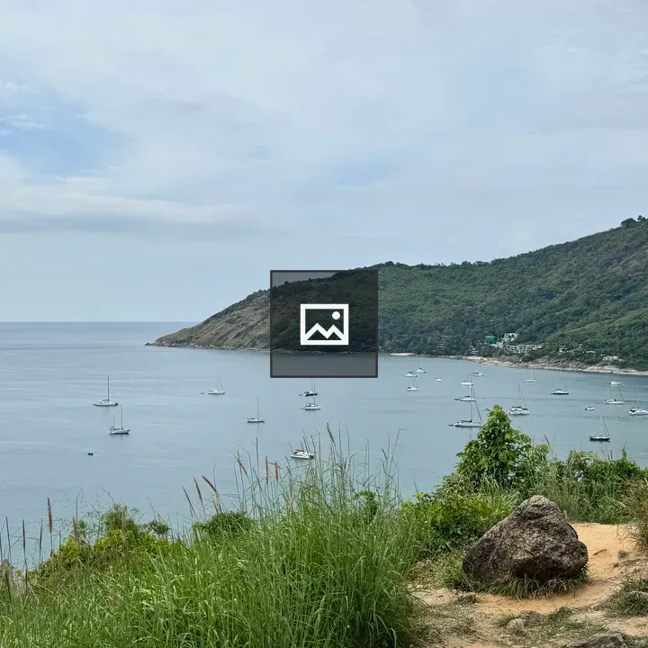 Scenic coastal viewpoint with sailboats