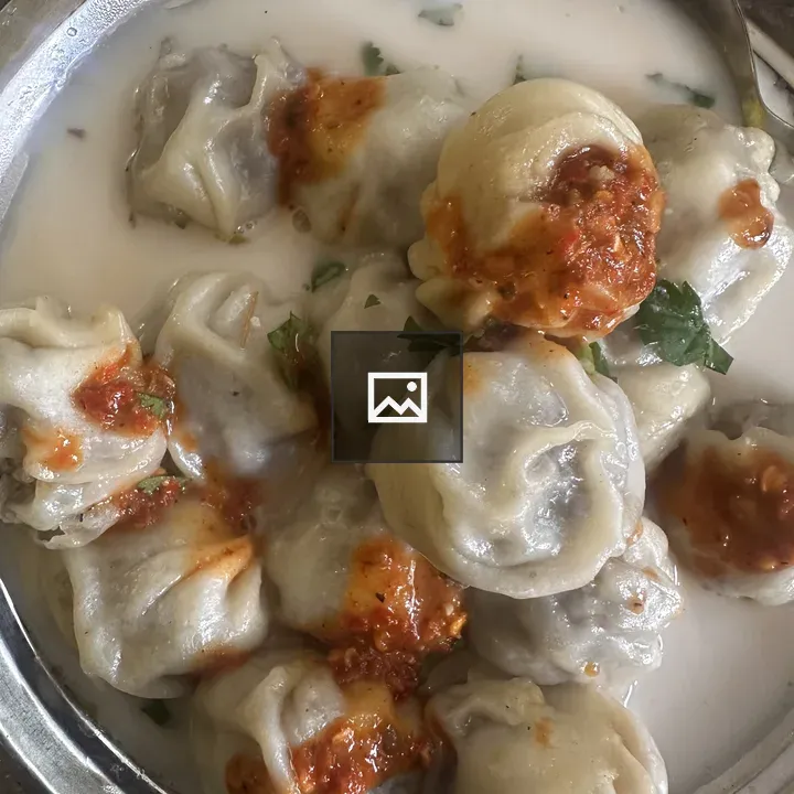 Delicious dumplings in creamy sauce