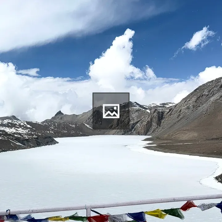 Snowy Mountains and Frozen Lake