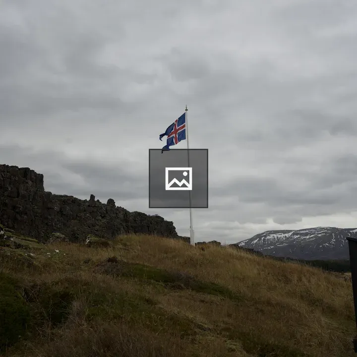 Flag Over Rocky Iceland Landscape
