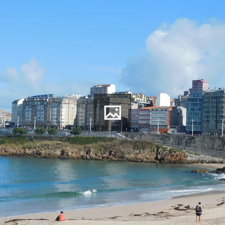 Coastal city with beach and buildings