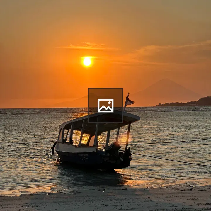 Boat on Shore at Sunset