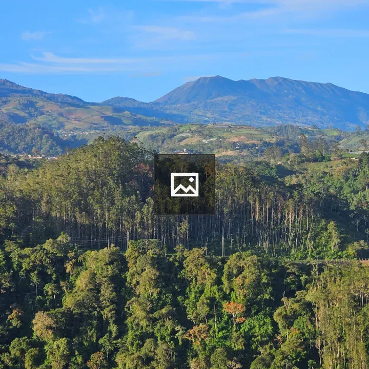 Mountain Peak over Rolling Hills