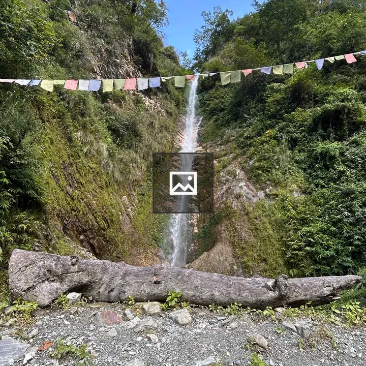 Waterfall over rocky hillside