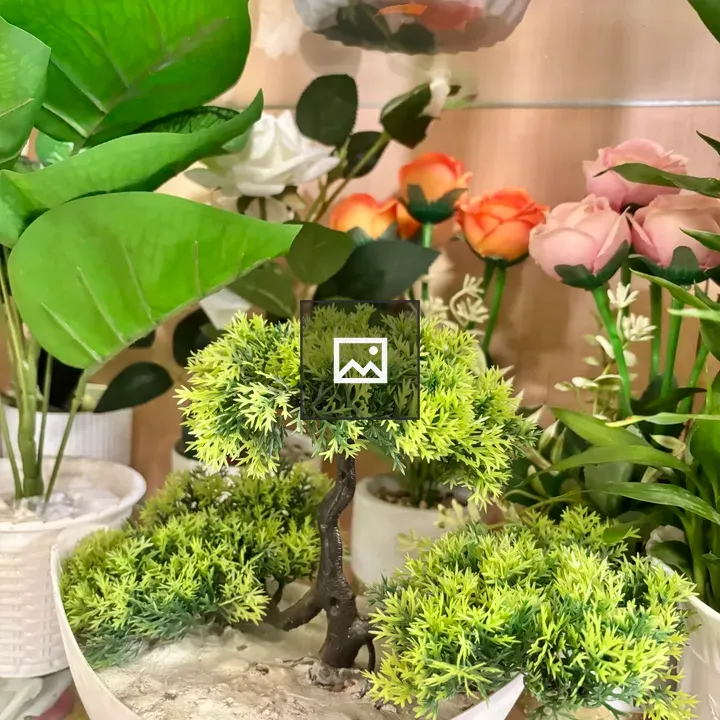 Artificial plant display in pot