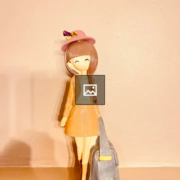 Smiling Girl Figurine and Suitcase