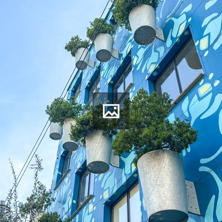 Blue Building with Giant Yellow Flowers